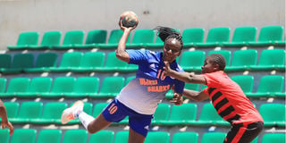 Priscilla Karungo (left) of Kenya Defence Forces vies with Sheila Imuge of Rising Stars