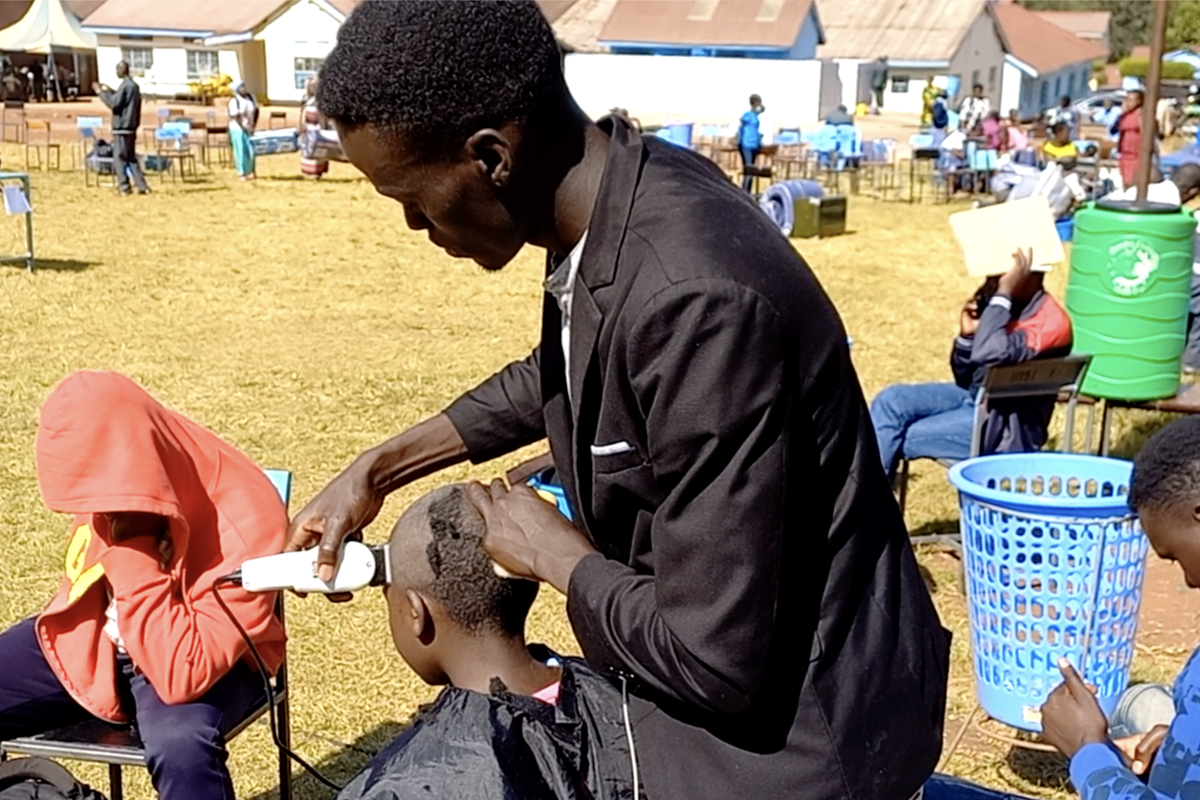 Girls line up to shave their heads ahead of form one admission at Kereri Girls in Kisii