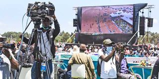 An NTV cameraman and other journalists at the Sirikwa Classic World Cross Country Tour in Eldoret, Uasin Gishu County