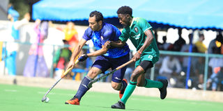 Mohamed Nourelden of Zamalek dribbles past Derrick Wakwabubi of Western Jaguars