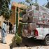 Men load boxes of ballot papers into a dispatch vehicle at the Nigeria's Independent Electoral Commission office in Kano