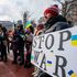 A person holds a sign calling to stop the war during a Stand with Ukraine rally at Copley Square in Boston, Massachusetts