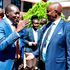Education Cabinet Secretary Ezekiel Machogu (right) confers with Kisii County Governor Simba Arati