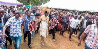 Azimio leader Raila Odinga and Siaya Governor James Orengo join other mourners during the burial of Ker Willis Opiyo Otondi