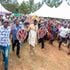 Azimio leader Raila Odinga and Siaya Governor James Orengo join other mourners during the burial of Ker Willis Opiyo Otondi