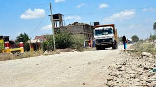 Motorists drive through the uncompleted section of Kimbo-Matangini Road