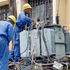 Kenya Power engineers fix a faulty transformer