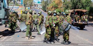 Police officers patrol Haile Selassie Avenue in Nairobi