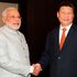 Indian Prime Minister Narendra Modi (left) shakes hands with Chinese President Xi Jinping 