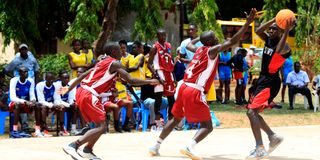 Sammy Mwai of Dr Aggrey High School from Taita Taveta County vies with Benard Odhiambo of Kaya Tiwi High School 