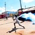 A protester throws a teargas canister back at anti-riot police in Kibra, Nairobi