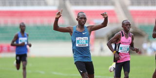 Vincent Kimaiyo crosses the finish line to win men's Under-20 5,000m race