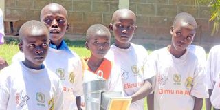 Primary school pupils learn about honey production and processing at the Kerio Valley honey plant in Baringo County