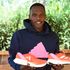 London Marathon Champion Amos Kipruto displays his running shoes 