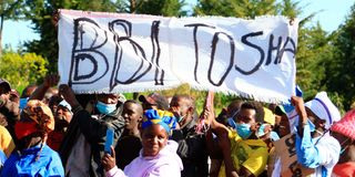 Youth display a placard to show support for BBI