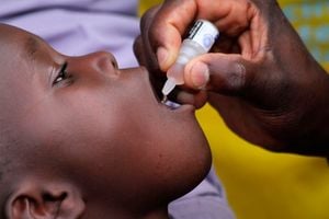 health officer administers polio vaccines 
