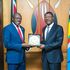 Speaker Moses Wetang'ula shares a light moment with Ghanaian High Commissioner Damptey Bediako