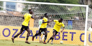 Tusker midfielder David Odoyo (centre) celebrates with teammates 