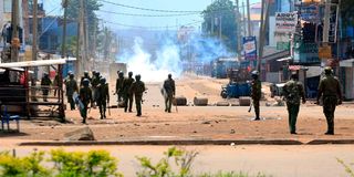 Police engage unruly youths during the Azimio la Umoja One Kenya protests at Kondele in Kisumu