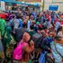 Travellers among them students wait to board Matatus at Afya Centre, Nairobi County