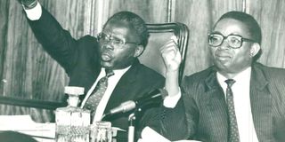 Then-Commissioner Justice Richard Otieno Kwach (left) and the Ouko Judicial Commission of Inquiry chairman, Mr Evans Gicheru