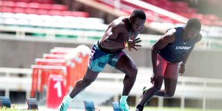 Africa 100m record holder Ferdinand Omanyala (left) trains with his younger brother Isaac Omurwa