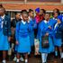 Secondary school students wait to board matatus at Afya Centre in Nairobi on May 9.