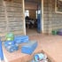 Learning going on at Kapindasum Primary Schools in Baringo South, with learners' metal boxes outside