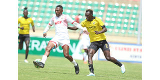 Ulinzi Stars defender Salim Swaleh (left) vies with Tusker midfielder Michael Oduor 
