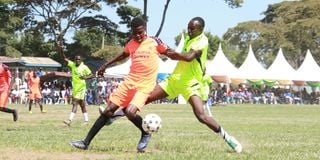 Segera FC’s Kelvin Kagiri (left) vies with Bridge Commandos' Isaac Ngigi 