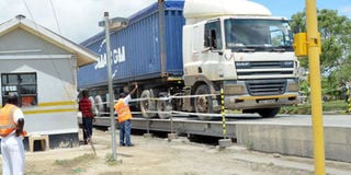 A cargo truck passes through the Mariakani Weighbridge, Kilifi County.