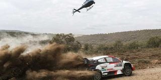 Sebastian Ogier navigated by Benjamin Veillas in a Toyota Yaris compete at the Hells Gate stage in Naivasha