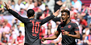 Bayern Munich's forward Kingsley Coman (right) celebrates