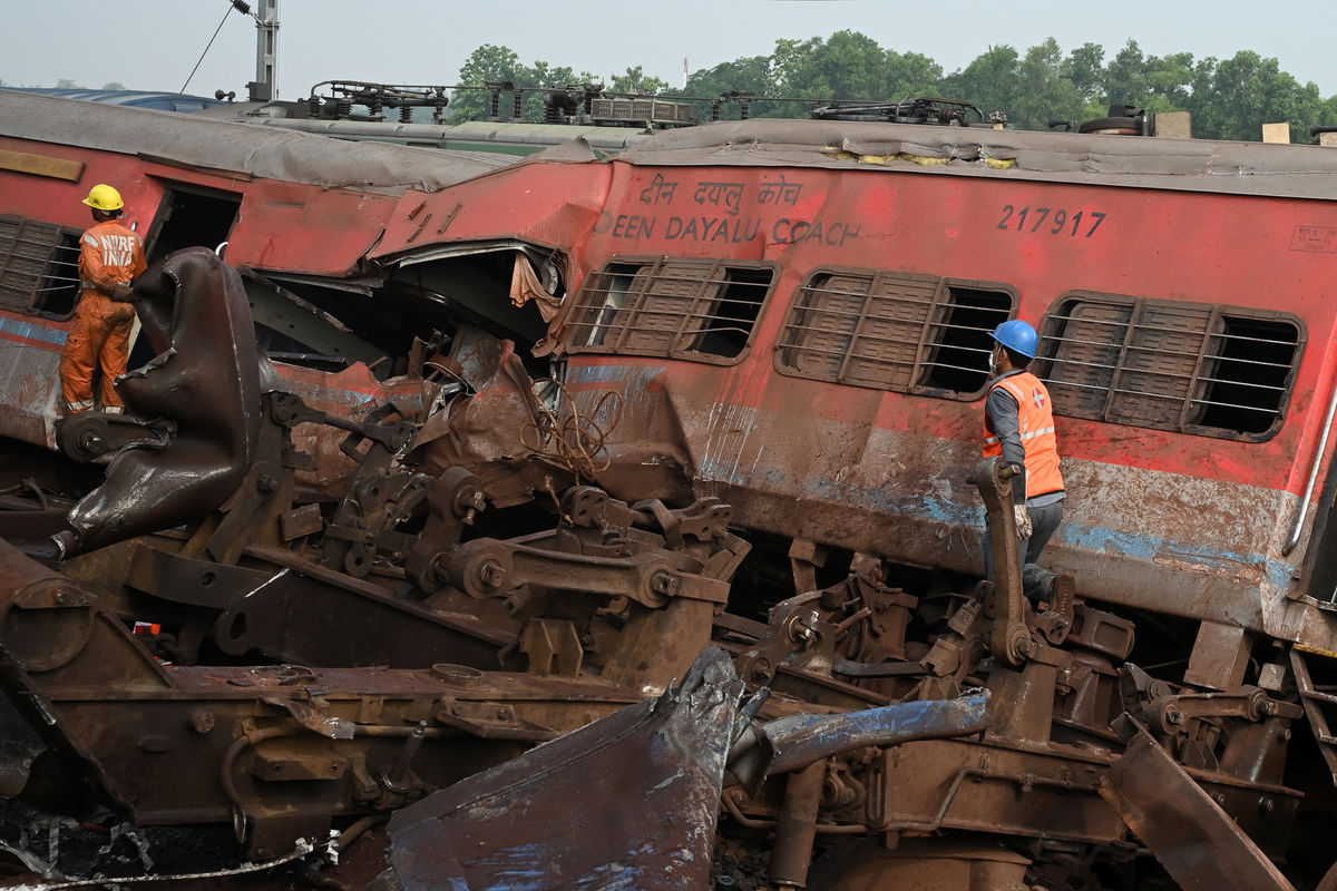 Wreckage piled high after India triple train crash