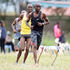 Dennis Mutuku (right) charges to the finish line in men's 10,000 metres race