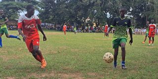 Kassim Suleiman (right) of Kirewe vies with Rajab Omar of Shimba Hills