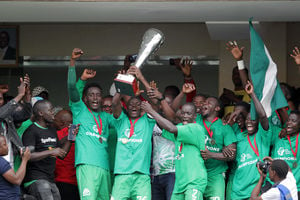 Gor Mahia players celebrate with the trophy