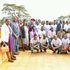 Governor Stephen Sang (in white coat at the centre) with some students and parents at Eliud Kipchoge Stadium in Kapsabet