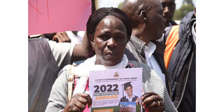 A parent affected in the messy Uasin Gishu Overseas Education program in tears during a protest at the governor's office