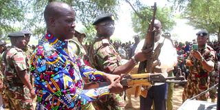 Governor Jeremiah Lomorukai and County Commissioner Jacob Ouma assessing illegal guns surrendered by civilians in Turkana South