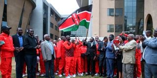 Sports Cabinet Secretary Ababu Namwamba (centre) flags off Team Kenya