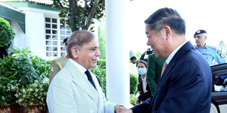 Pakistan Prime Minister's Office, Pakistan's Prime Minister Shehbaz Sharif, left, greets Chinese Vice Premier He Lifeng