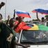 Supporters of the junta wave Russian flags as they demonstrate in Niger’s capital Niamey