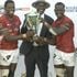 Kenya Sevens players celebrate with the trophy 