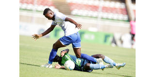 Bandari's Beja Nyamawi (top) vies for the ball with KCB's Kennedy Ochino
