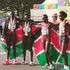 Team Kenya celebrate with the flag after women's half marathon race