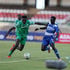 Gor Mahia defender Rooney Onyango (left) vies with AFC Leopards forward Victor Otieno