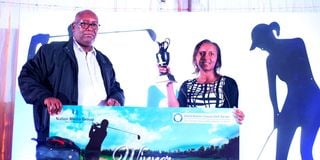 NMG CEO Stephen Gitagama (left) awards Nation Classic Golf Series overall winner Sandra Kabiru