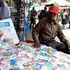 Nephat Thuo, a trader along Luthuli Avenue in Nairobi, arranges success cards
