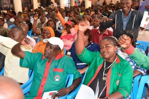 Teachers raise their hands at Kakamega Hill School 
